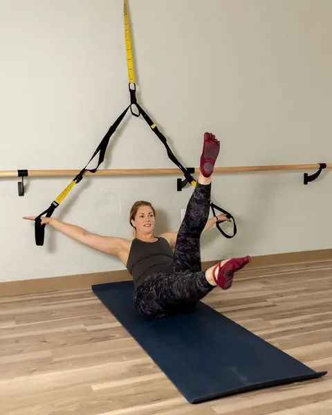 Client working core control on a mat in the HealthSPORT Align studio
