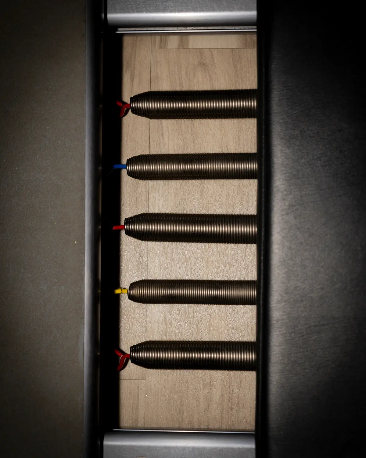 Close-up of colored springs on a Pilates reformer at HSAlign