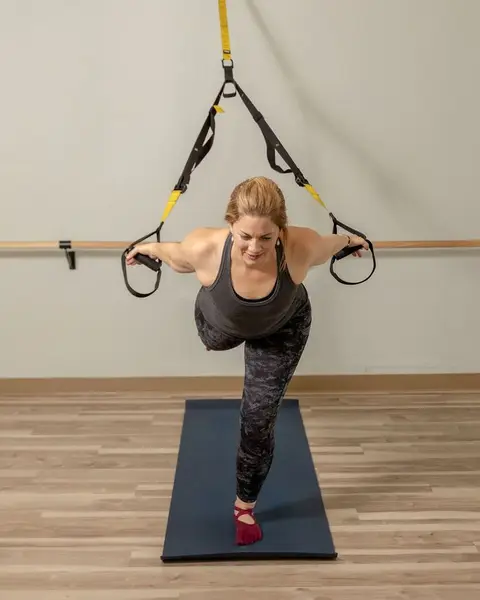 Client holding a controlled row under instructor coaching at HealthSPORT Align