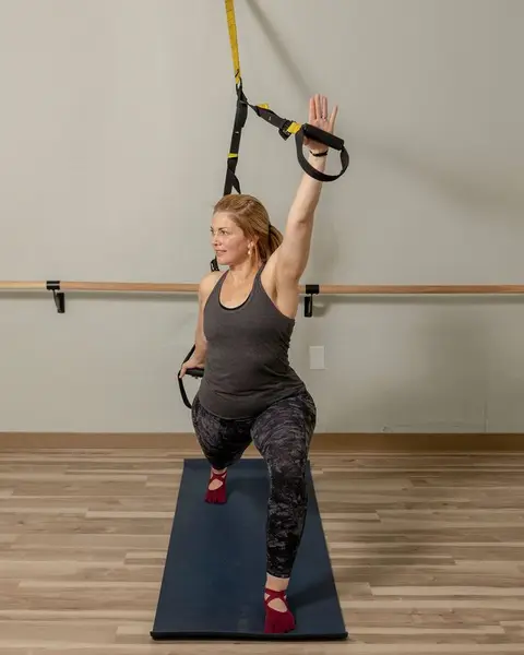 Client reaching through a full-length extension at HealthSPORT Align