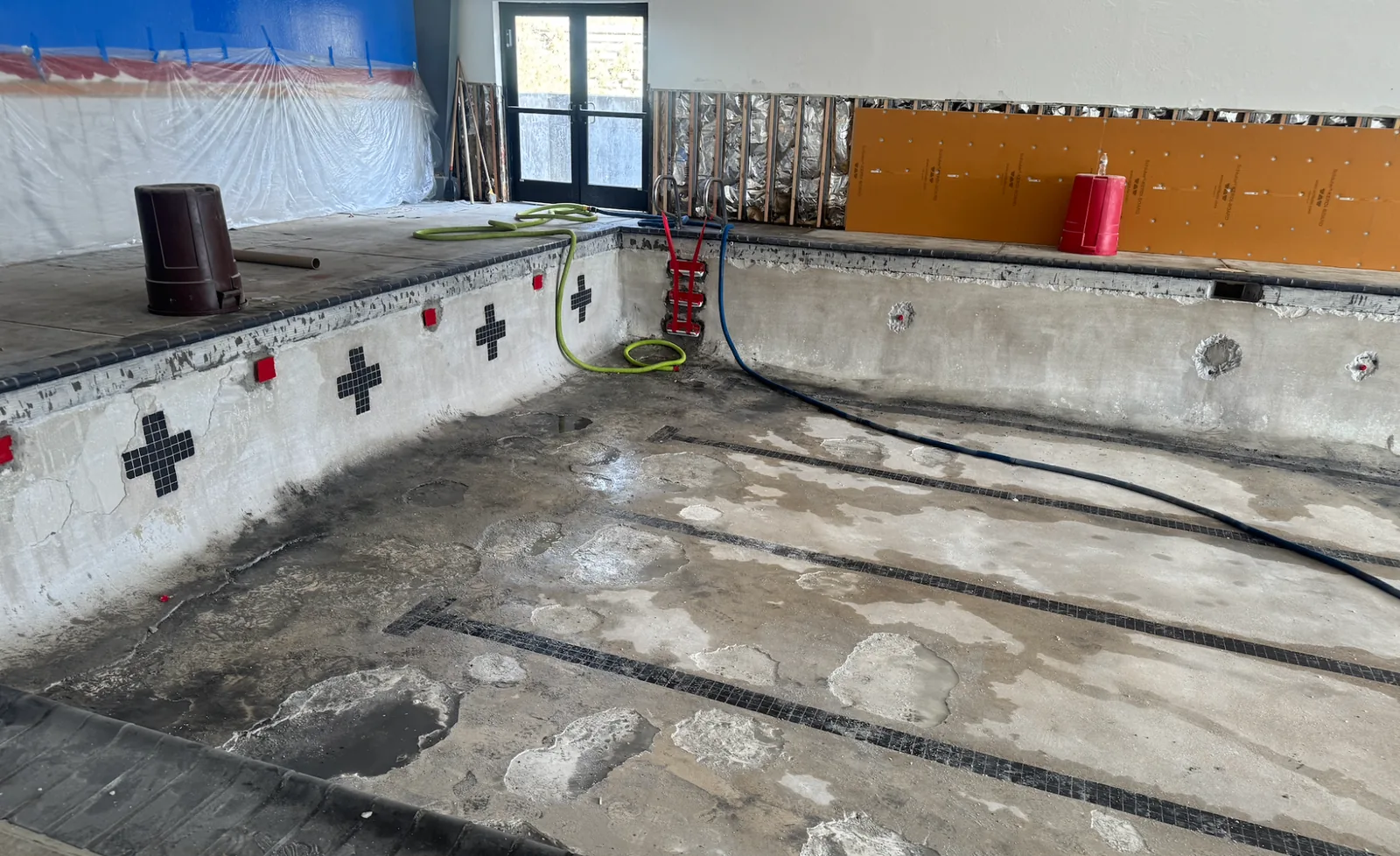 Arcata pool wall tile and surrounding wall work in progress