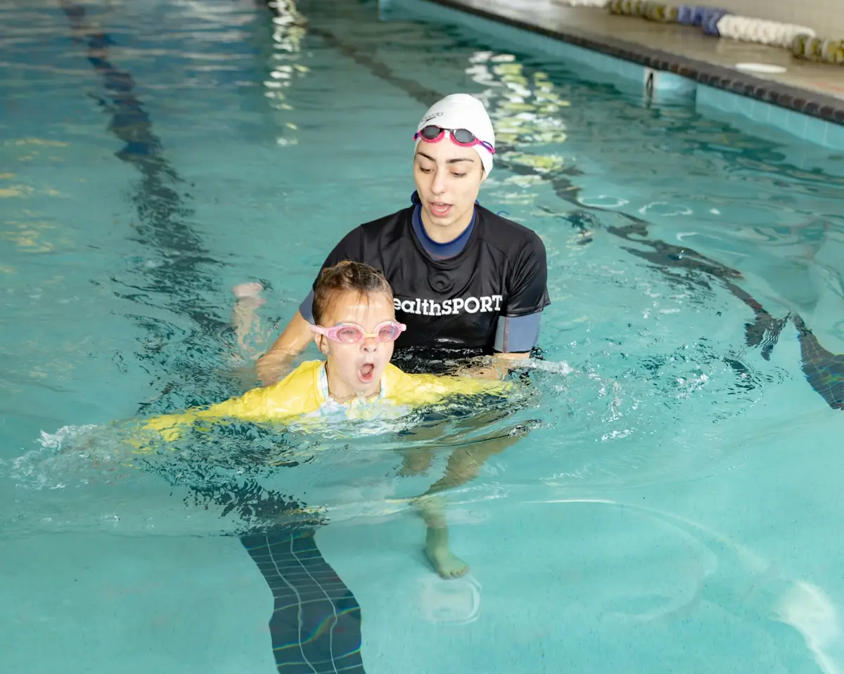 Swim Academy swimmer training with coach