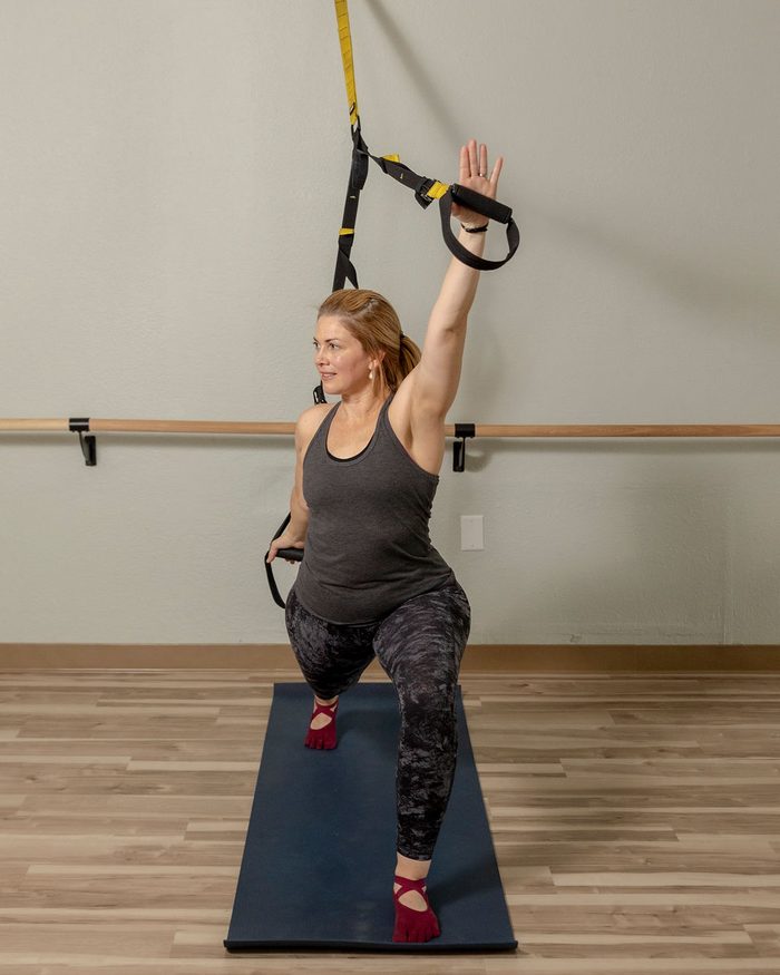 Client reaching through a full-length extension at HealthSPORT Align