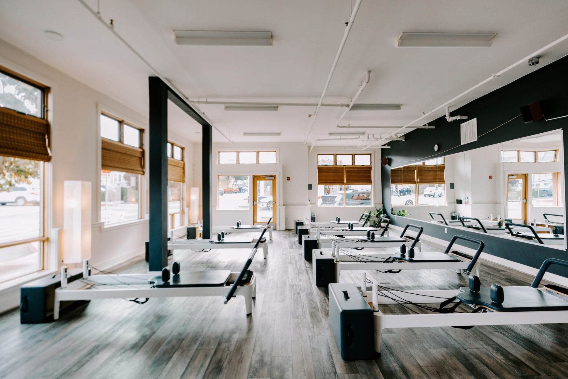 The HS Align Arcata studio floor with rows of Pilates reformers and mirrored walls