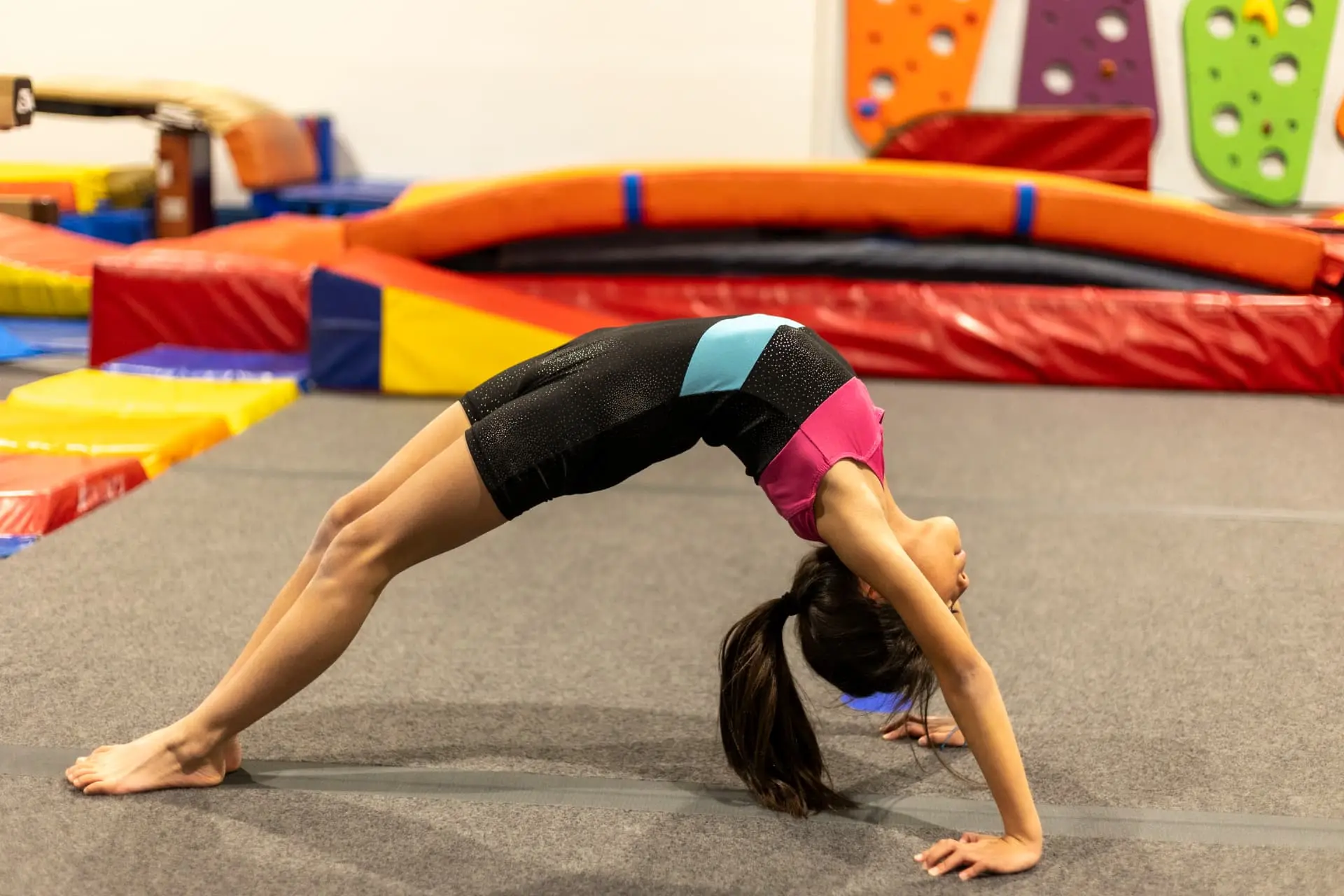Young gymnast practicing a backbend at HealthSPORT Gymnastics Fortuna