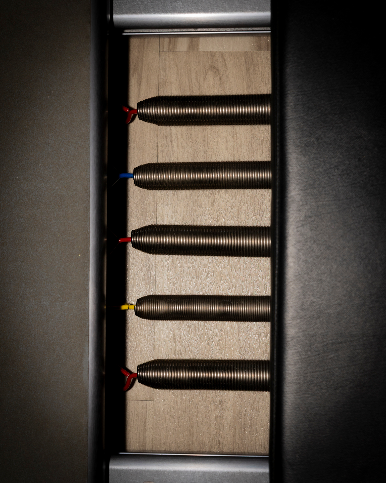 Close-up of colored springs on a Pilates reformer at HSAlign